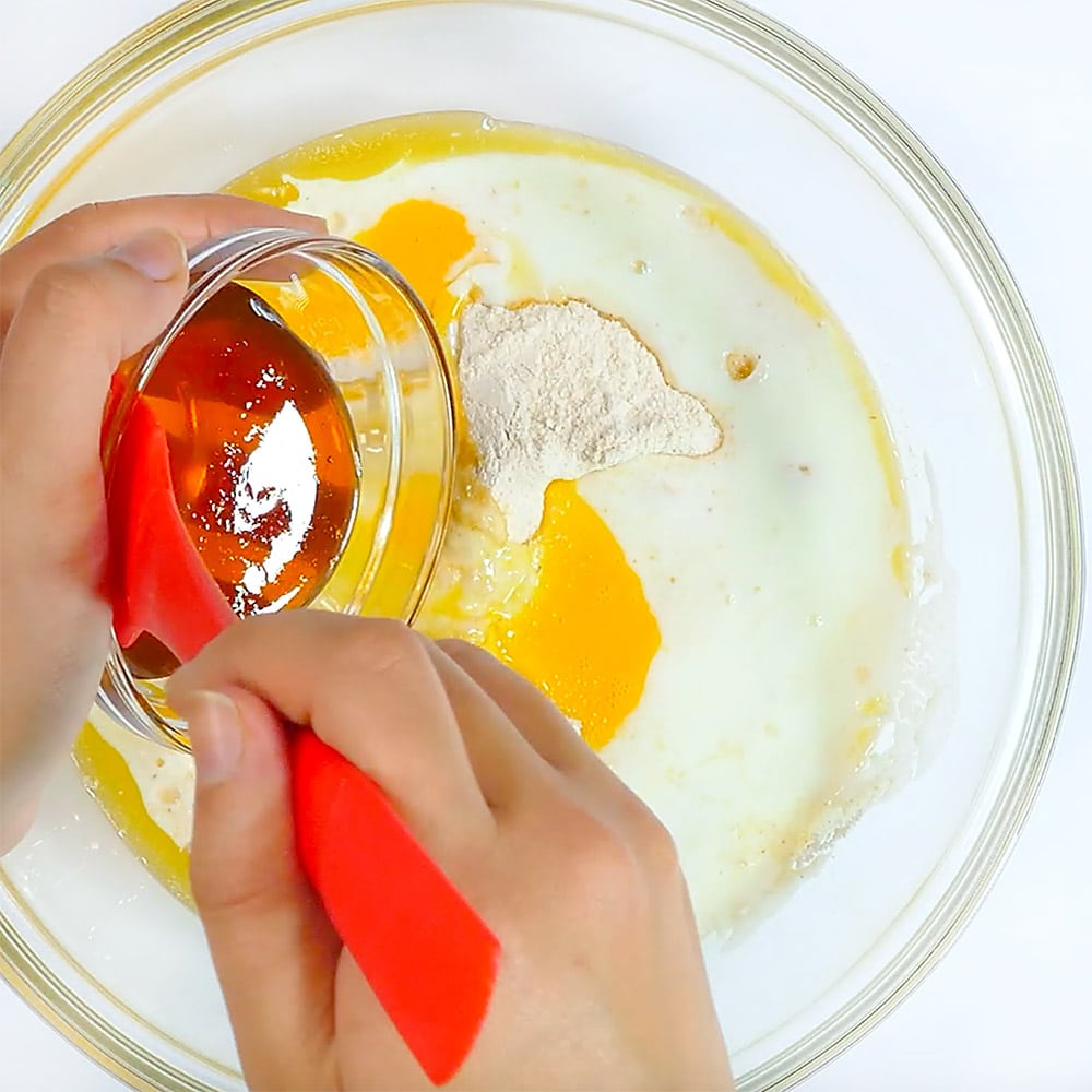 Combining ingredients in a bowl.