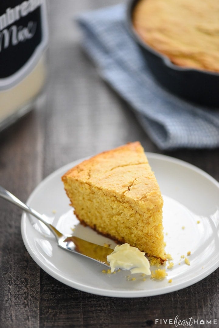 Wedge of cornbread with butter.
