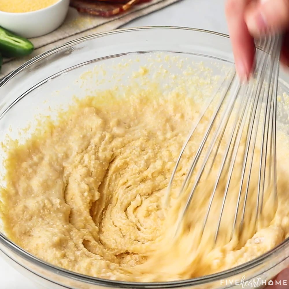 Whisking batter in bowl.