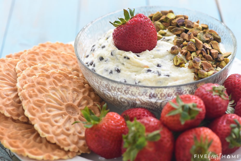 Bowl of Cannoli Dip, pizzelles, and strawberries.