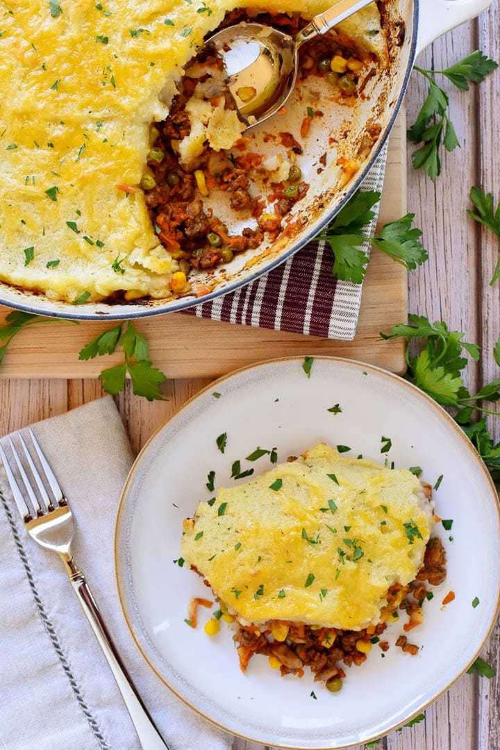 Aerial view of Easy Shepherd's Pie recipe in skillet and on plate.