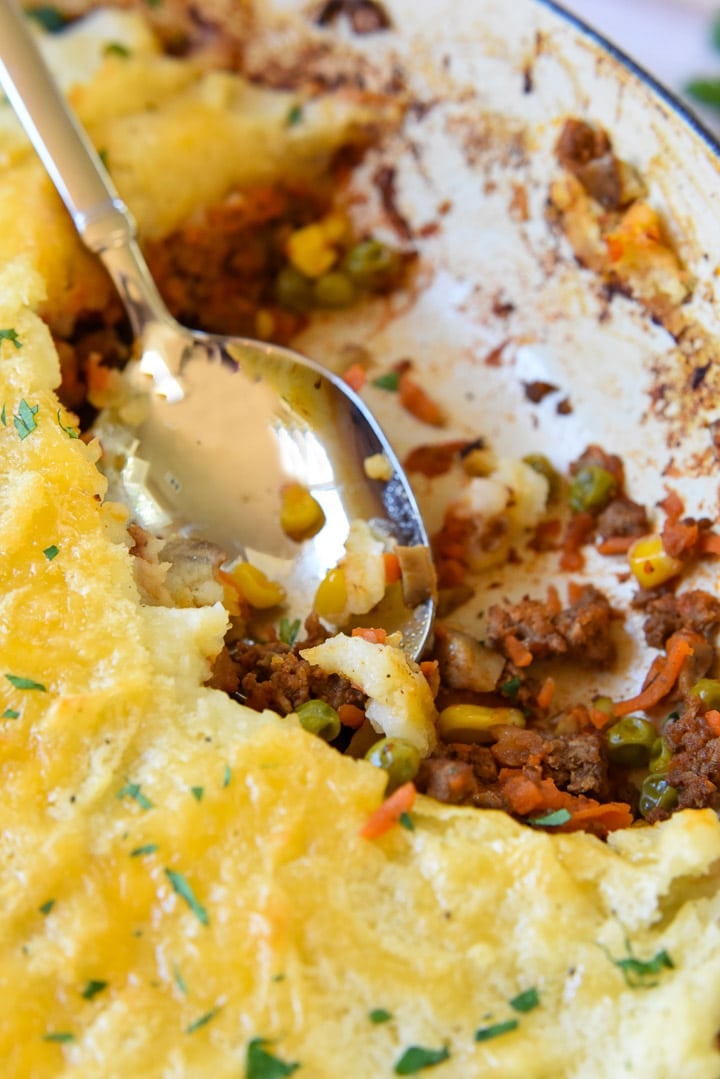 Spoon digging into Easy Shepherd's Pie recipe.