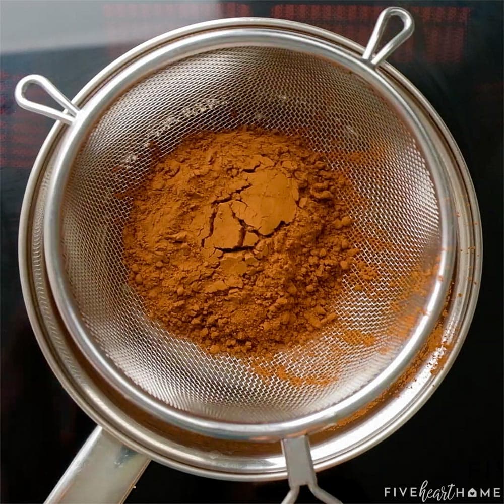 Aerial view of cocoa powder being sifted.