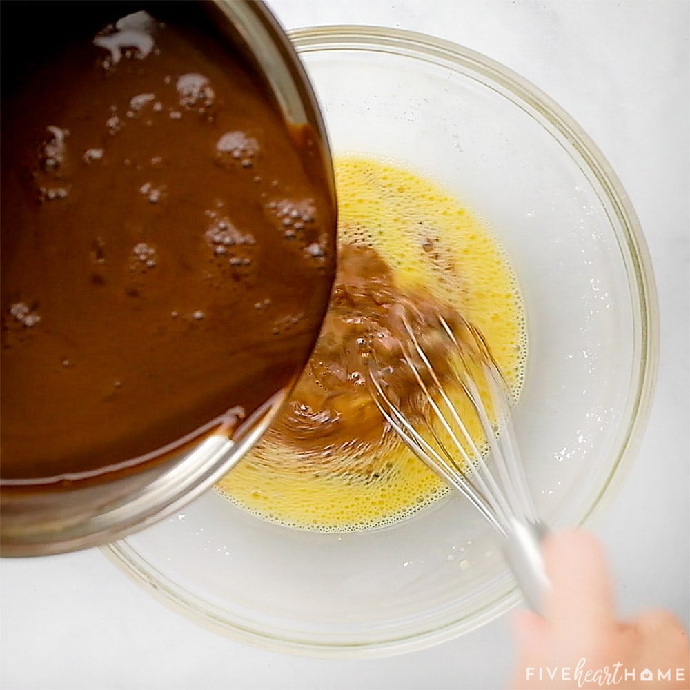 Pouring cocoa mixture into egg mixture.