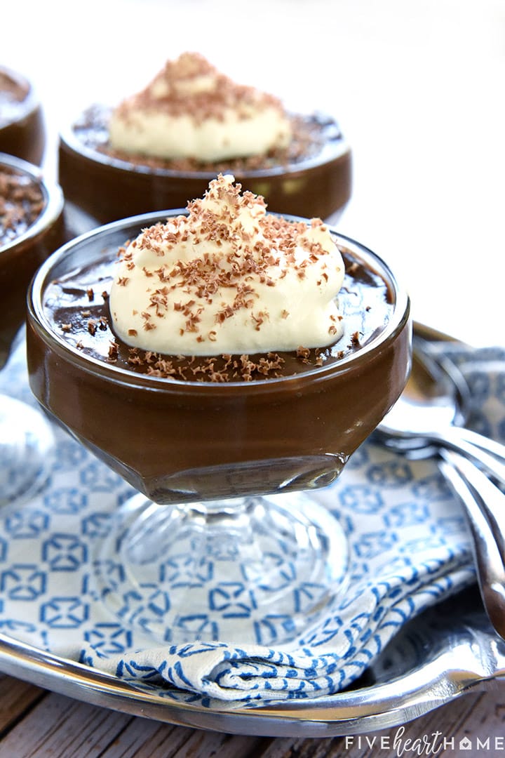 Close-up of chocolate pudding with whipped cream on top.