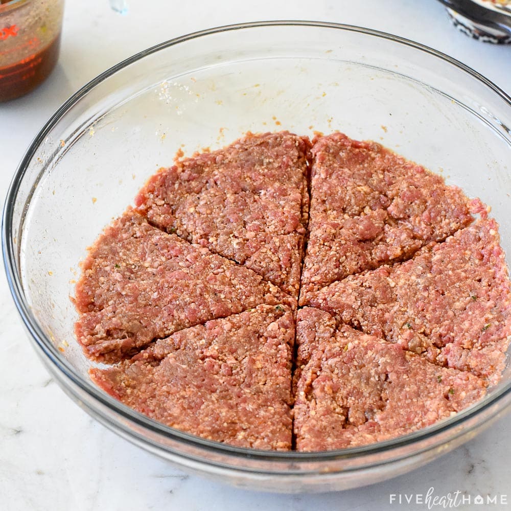 Meatloaf mixture divided into six equal pieces.