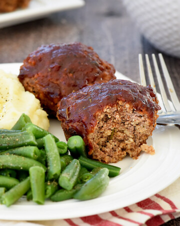 Mini Meatloaf recipe, featuring two meatloaf muffins on a plate.