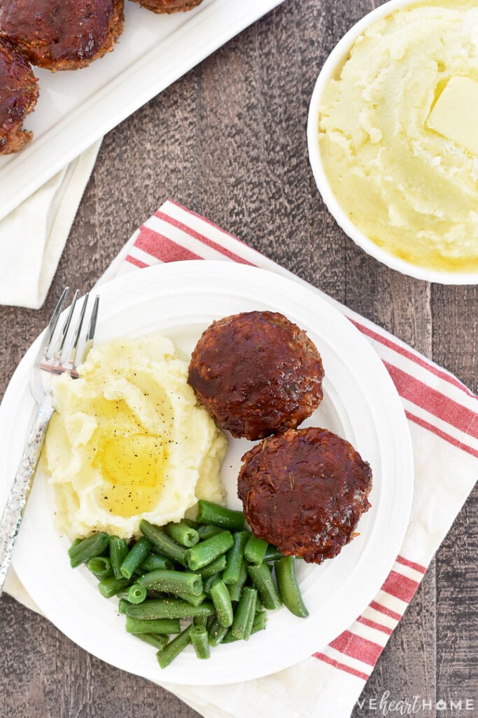 Aerial view of Mini Meatloaf recipe on plate.