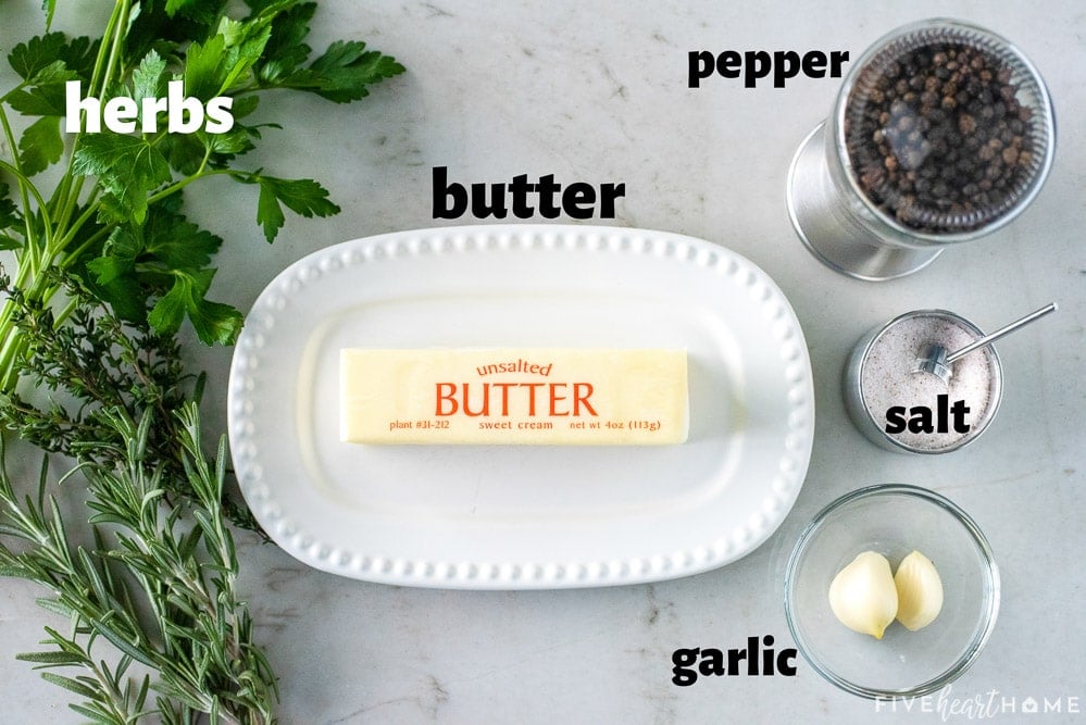 Aerial view of labeled herb butter ingredients.