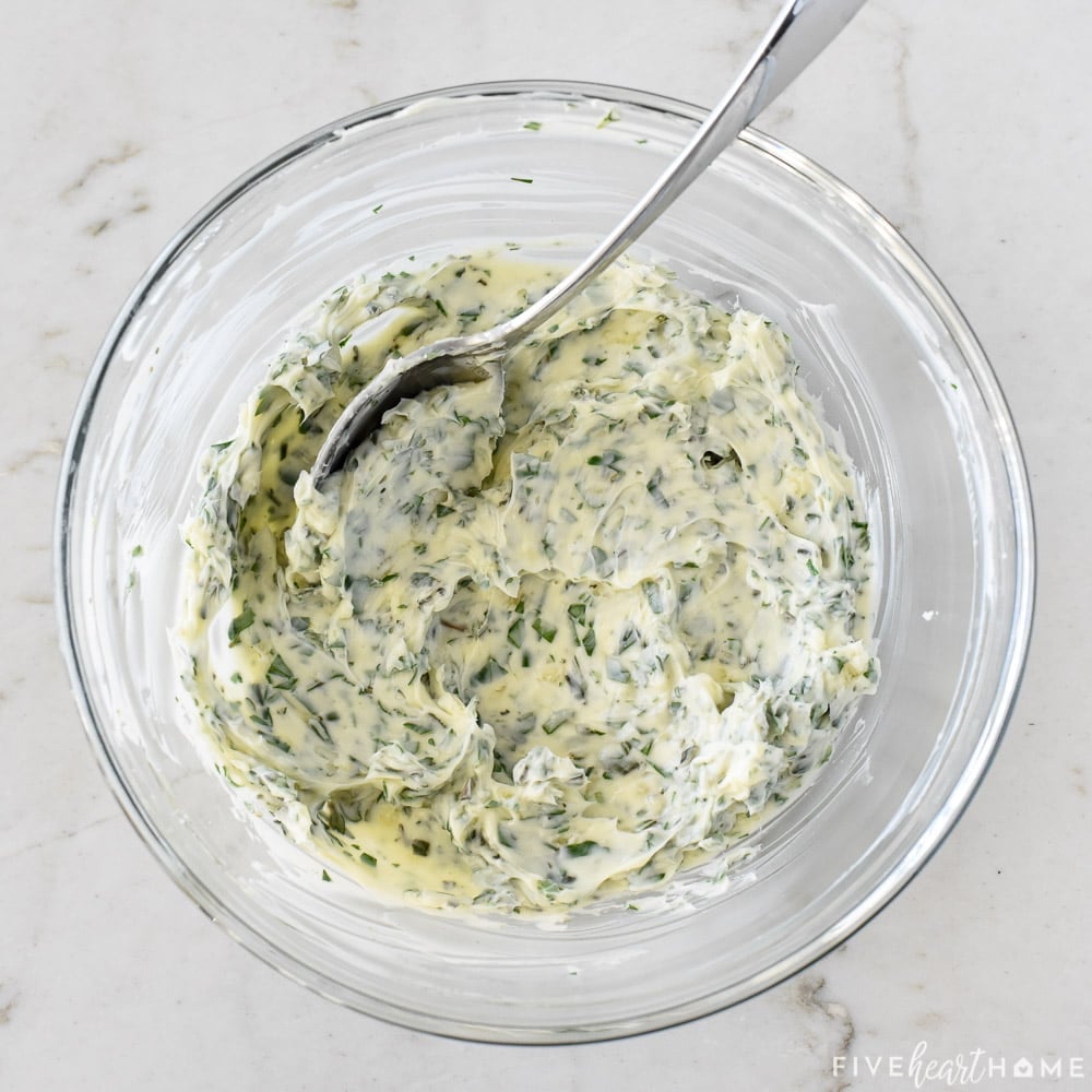 Herb butter combined in bowl.