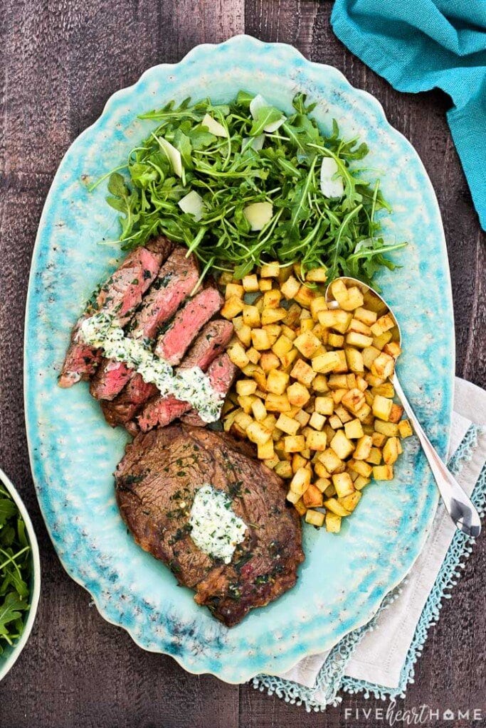 Aerial view of Steak Frites arranged on platter.