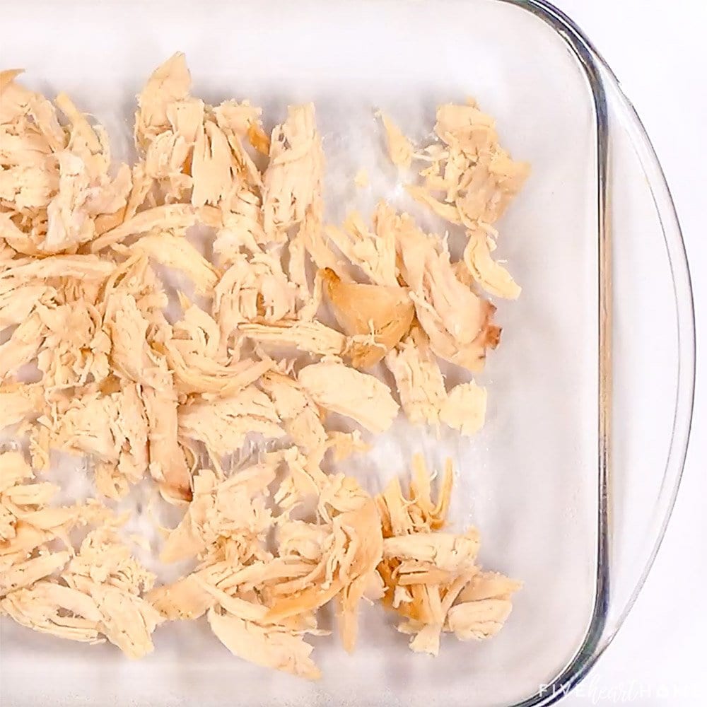 Shredded chicken in bottom of baking dish.