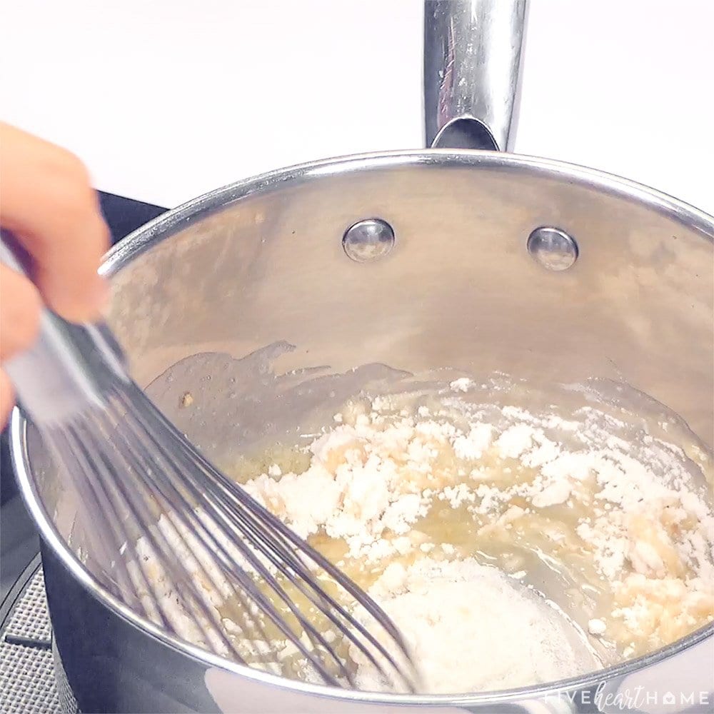 Flour being whisked into butter.