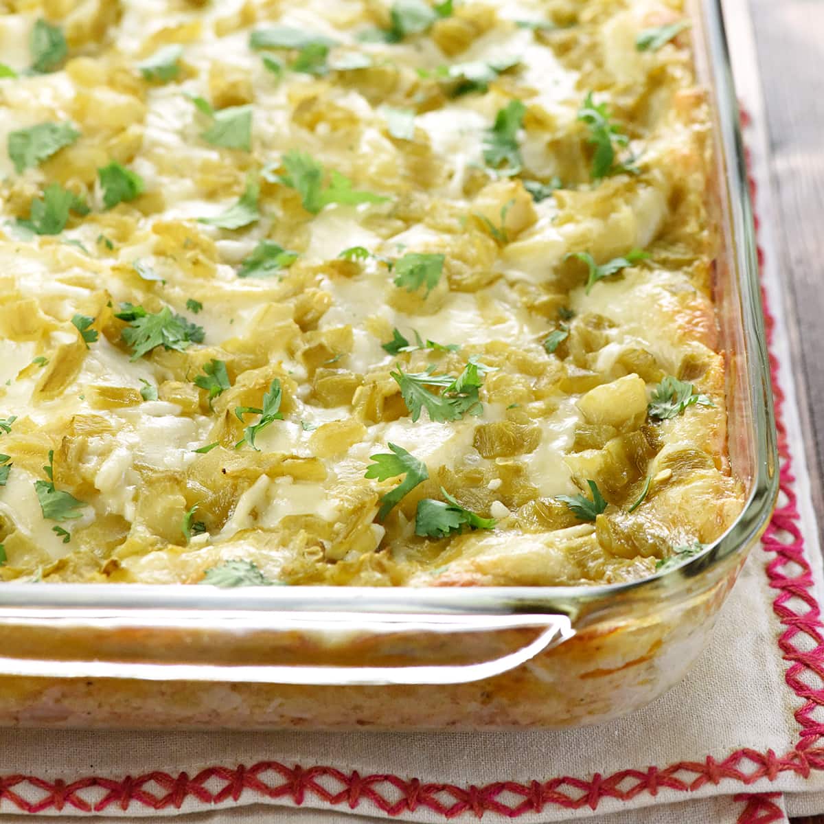 Chicken Enchilada Casserole in glass baking dish.