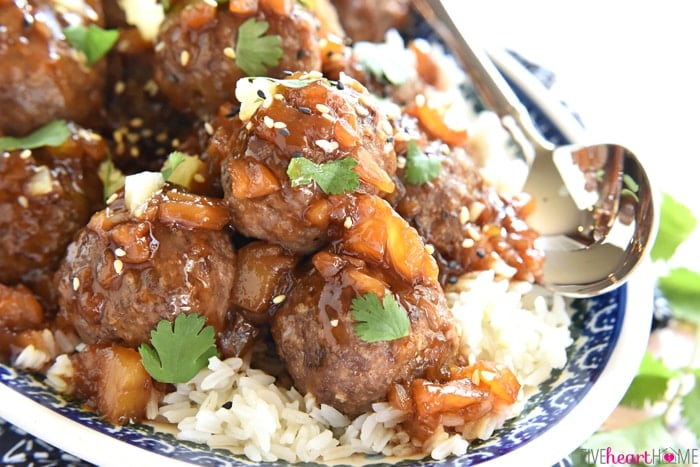 Hawaiian Meatballs on platter of rice with spoon.