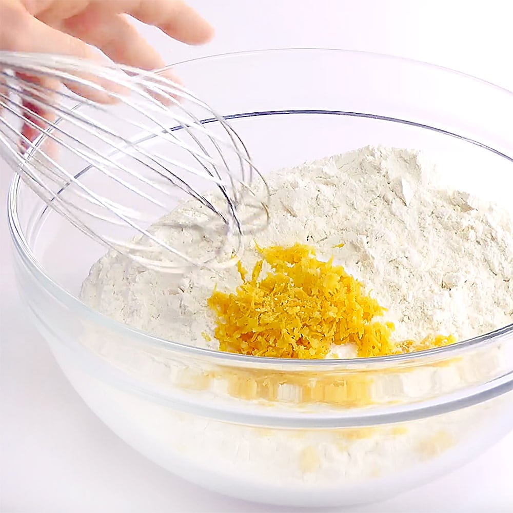 Whisking dry ingredients and lemon zest for Lemon Pound Cake.