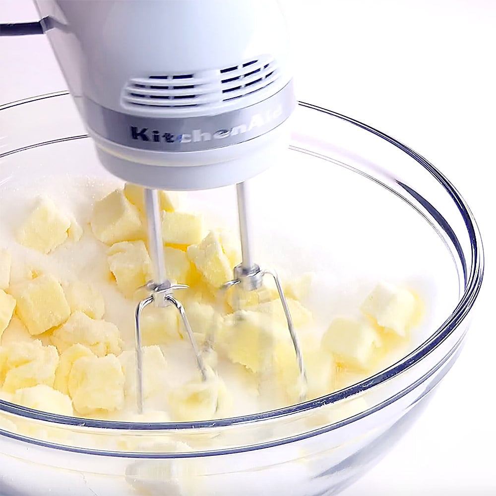 Beating butter into sugar.