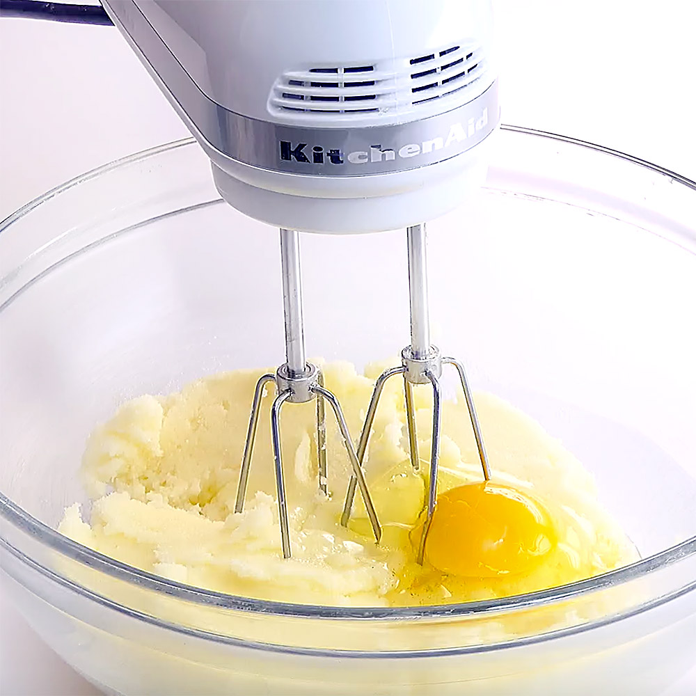 Blending eggs into Lemon Pound Cake recipe batter.