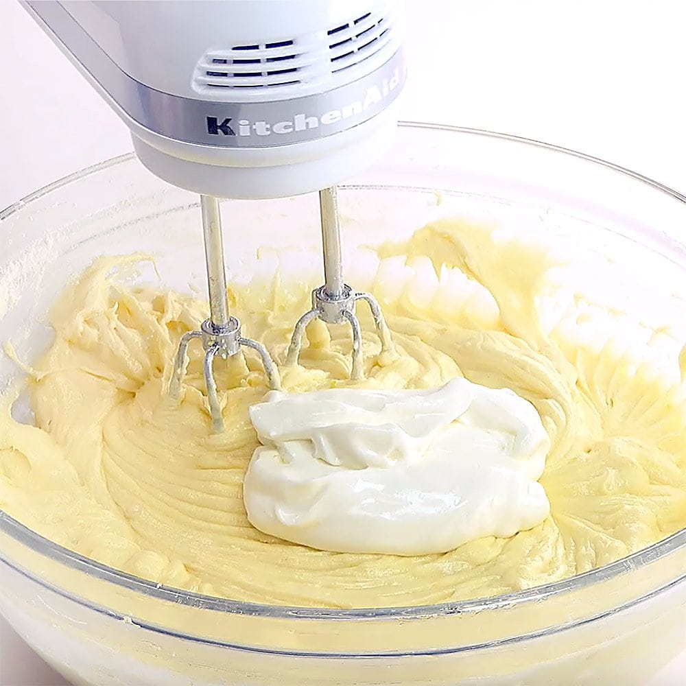 Blending sour cream into Lemon Pound Cake batter.