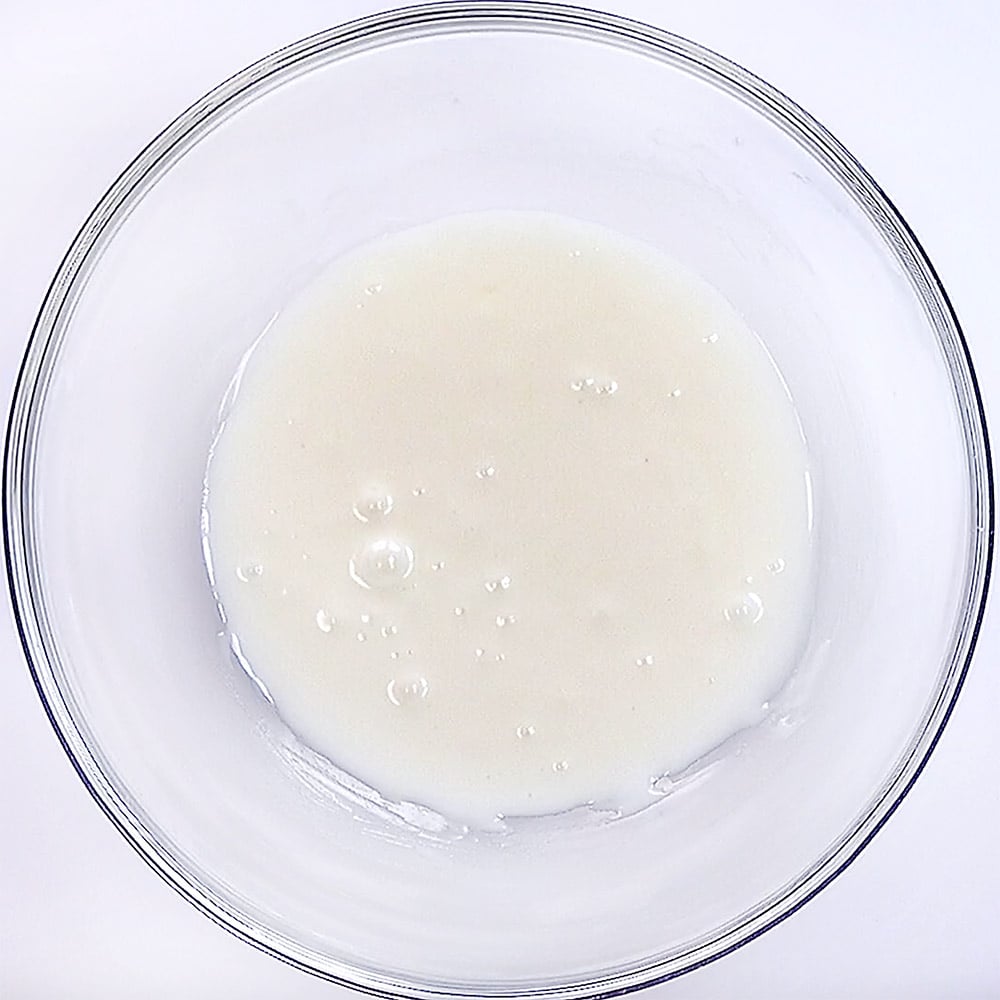 Lemon glaze for pound cake in bowl.