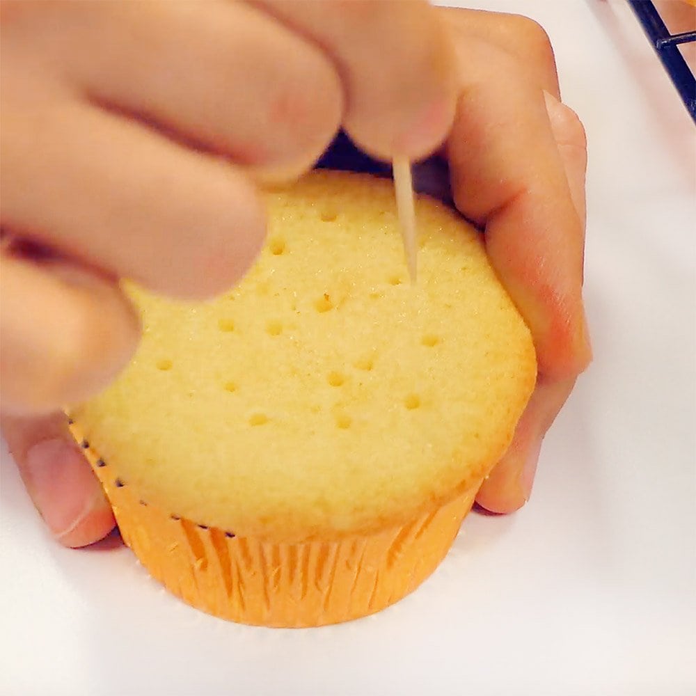 Poking holes with toothpick.