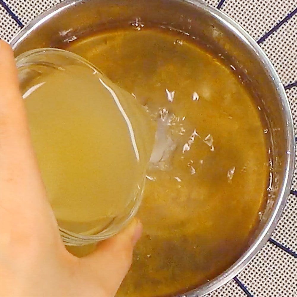 Adding lemon juice to simple syrup.