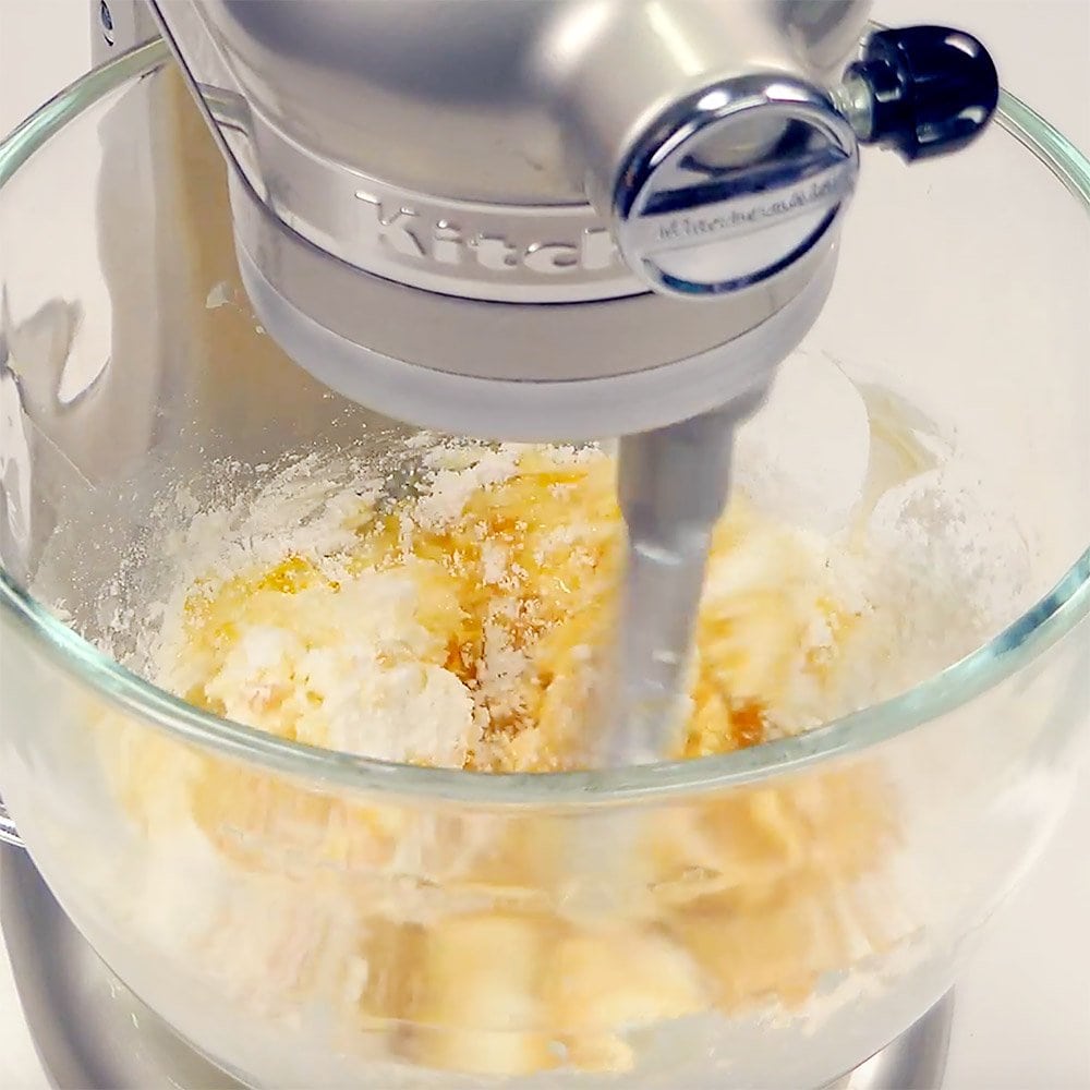 Blending Lemon Cream Cheese Frosting with mixer.