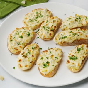 Artichoke Bruschetta on white platter.