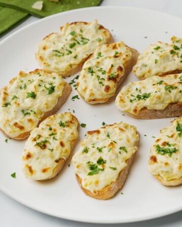 Artichoke Bruschetta on white platter.
