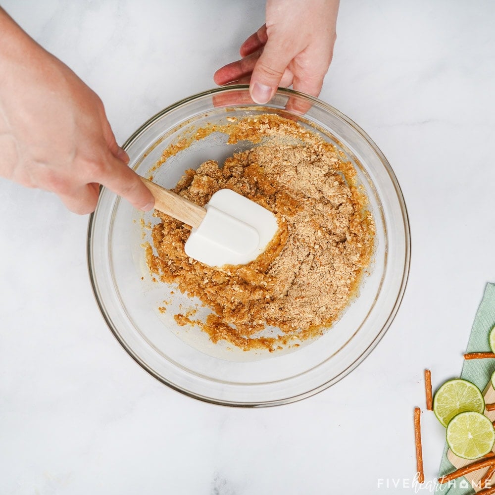 Stirring together pretzel crust.