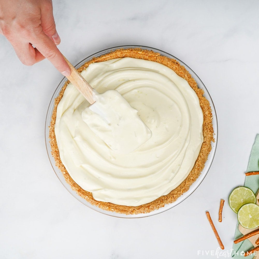 Spreading the filling into the crust.