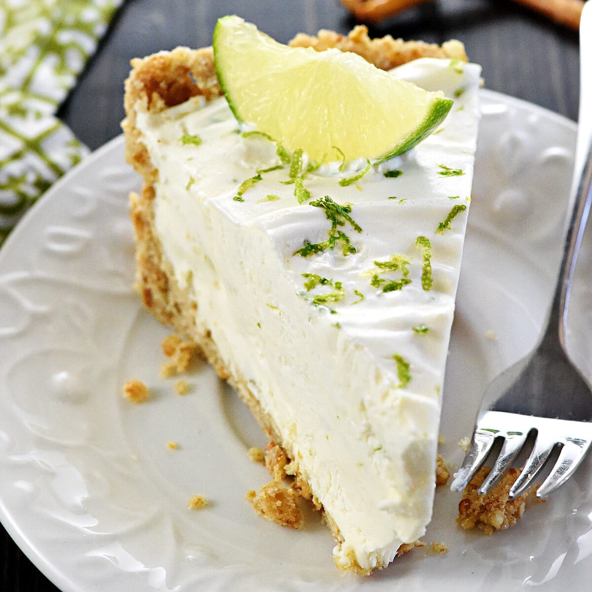 Slice of No-Bake Frozen Margarita Pie on a plate.