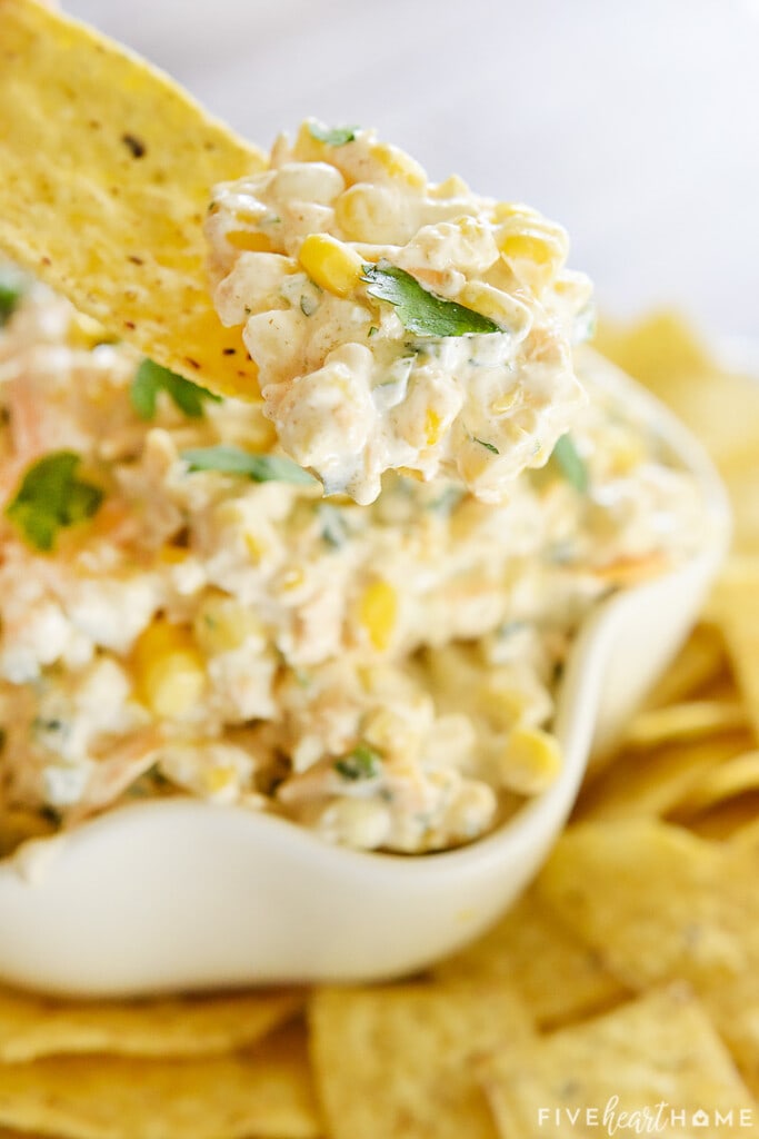 Corn Dip recipe scooped on tortilla chip.