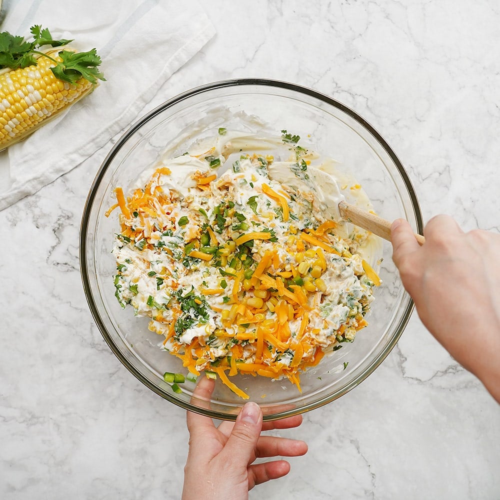 Stirring together the ingredients with a spatula.