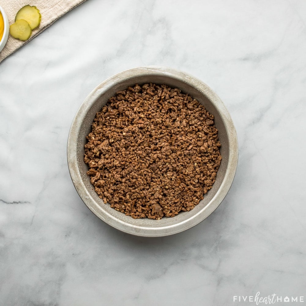 Ground beef spread in baking dish.