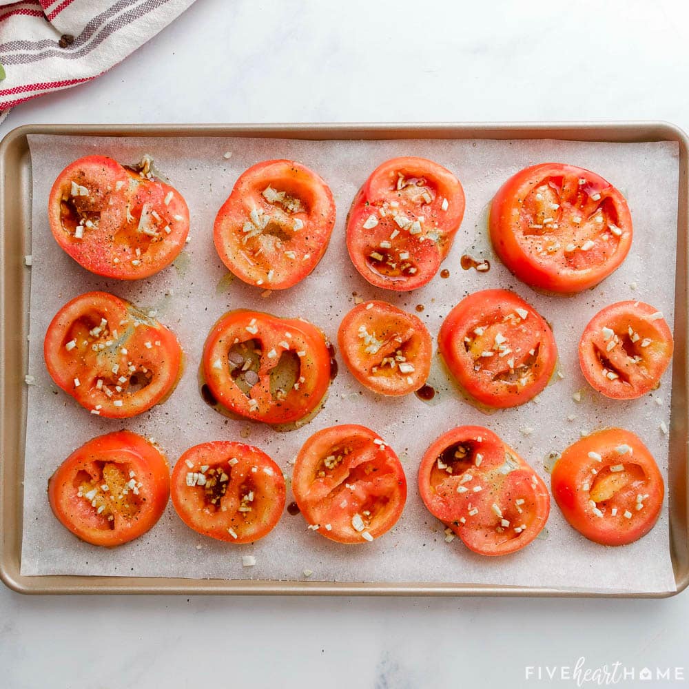 Tomato slices seasoned with salt and pepper.