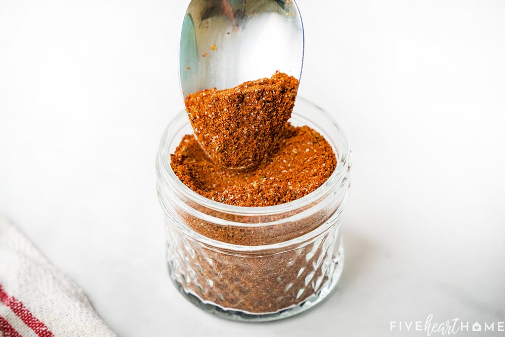 Chili Seasoning recipe spooned into jar.