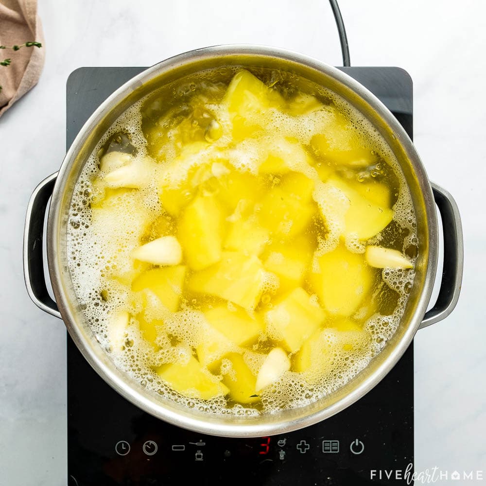 Pot boiling on stove.