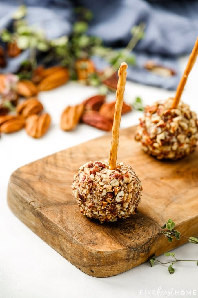 Close-up of Mini Cheese Balls on wooden board.