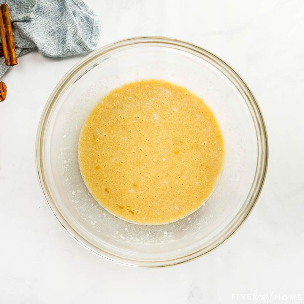 Wet ingredients combined in glass bowl.