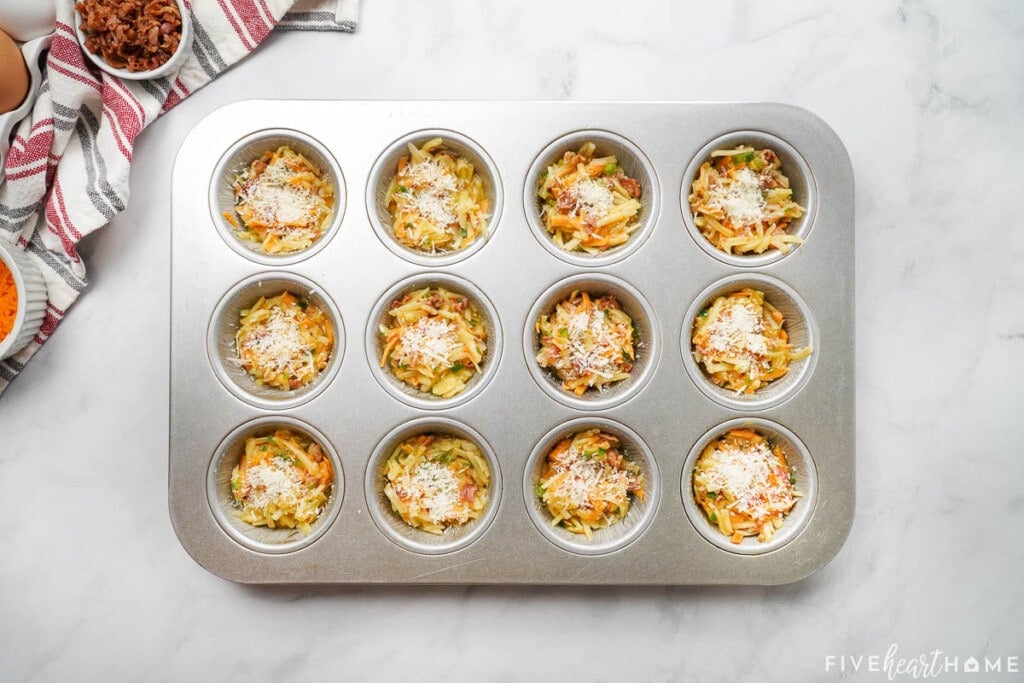 Mini muffin frittatas topped with Parmesan.