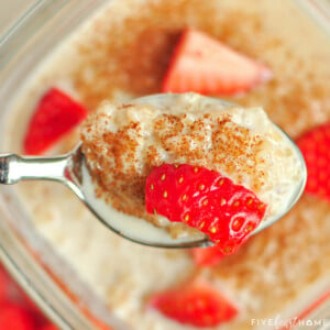 Spoonful of Quinoa Pudding with cinnamon and strawberries.