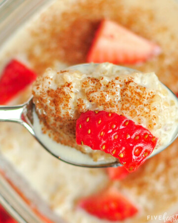 Spoonful of Quinoa Pudding with cinnamon and strawberries.