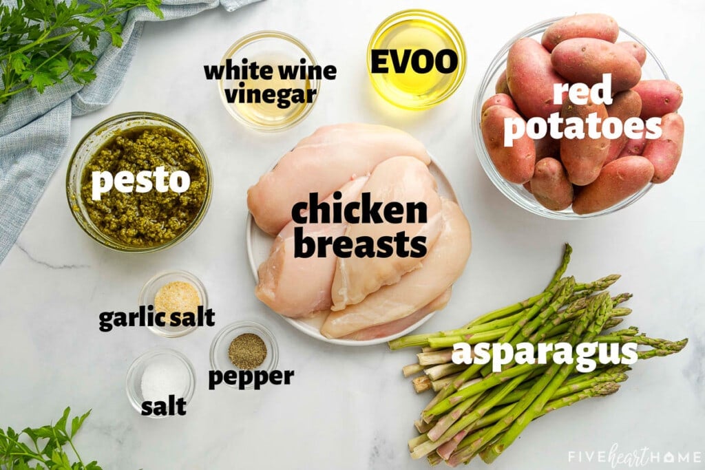 Aerial view of labeled ingredients to make Sheet Pan Chicken and Veggies.