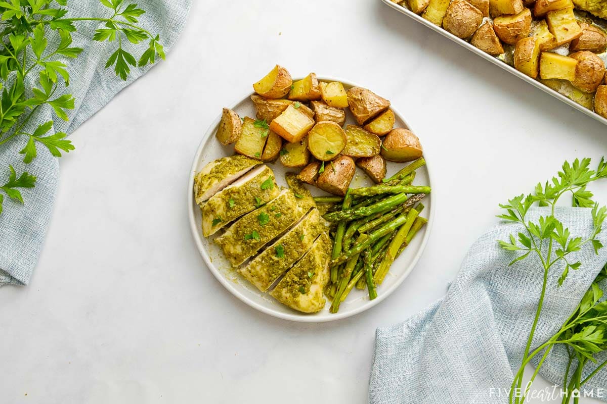 Serving of Sheet Pan Chicken and Veggies on white plate.