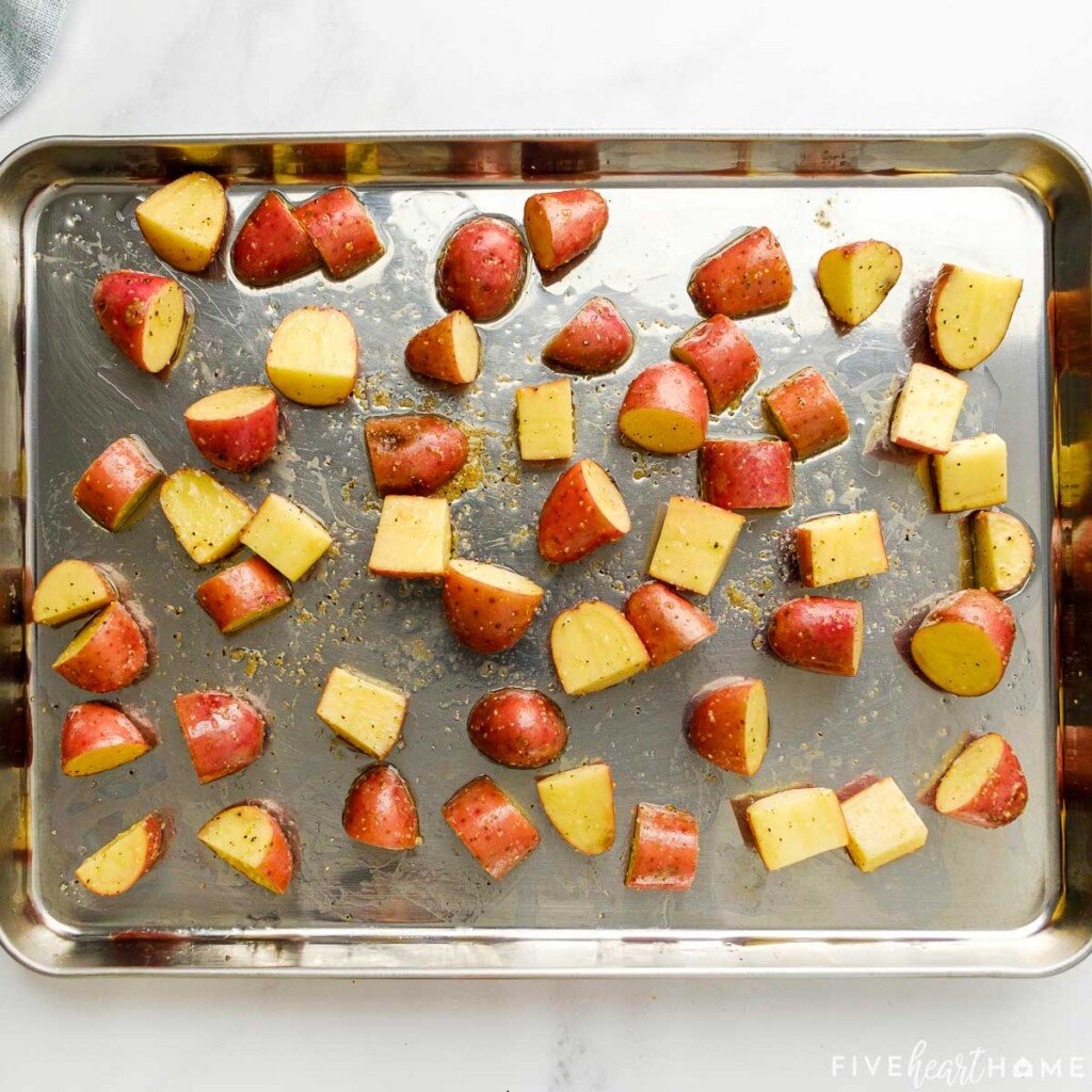 Cut red potatoes on sheet pan.