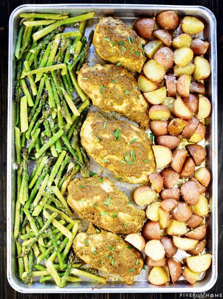 Aerial view of Sheet Pan Chicken and Veggies with parsley garnish.