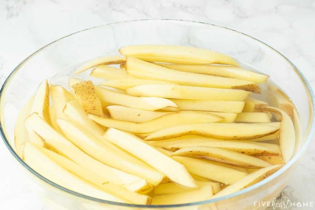 Soaking potatoes in water for Season Fries recipe.