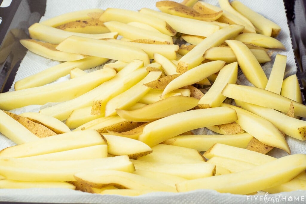 Potatoes soaked and ready for the oven to make spicy fries.