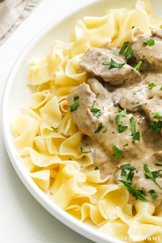 Crock Pot Beef Stroganoff recipe close-up garnished with parlsey.